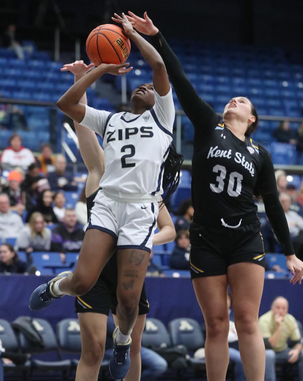 Akron's Alexus Mobley shoots as Kent State's Abby Ogle and Mikala Morris defend on Jan. 20 in Akron. Mobley scored 23 points to lead the Zips to a win at Central Michigan on Saturday.