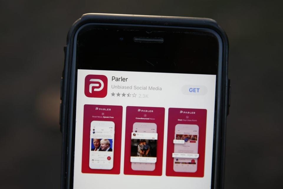 A general view of the the Parler app icon displayed on an iPhone on January 9, 2021 in London, England. The Parler App popular with right-wing supporters has been suspended from Google’s Play store over continued postings by users that incite violence. US President Donald Trump was suspended indefinitely from Twitter after tweets he made encouraged his supporters to break into the Capitol building and five people died in the ensuing violence. (Photo by Hollie Adams/Getty Images)