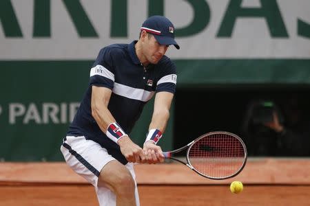 Tennis - French Open - Roland Garros - John Isner of the U.S. v Andy Murray of Britain - Paris, France - 29/05/16. John Isner returns the ball. REUTERS/Pascal Rossignol