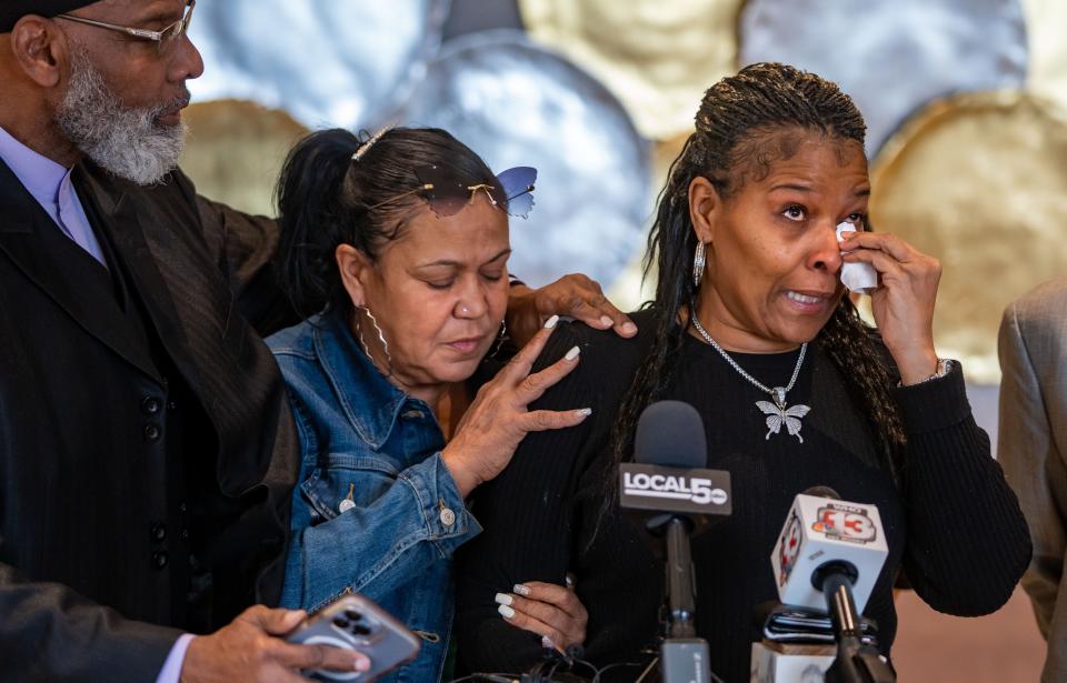 Nicole Sanders, Rashad Carr's grandmother, right, is comforted by Ako Abdul-Samad, left, and Heather Parrish as she speaks about her grandson during a news conference, Wednesday, Jan. 25, 2023.