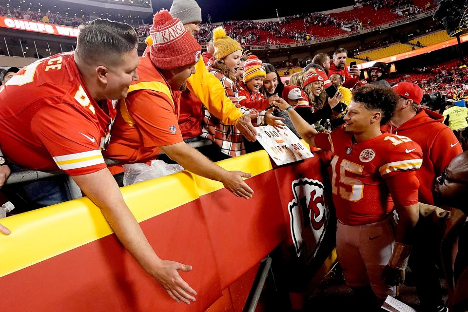Kansas City Chiefs quarterback Patrick Mahomes celebrates with fans after an NFL football game against the Tennessee Titans Sunday, Nov. 6, 2022, in Kansas City, Mo. The Chiefs won 20-17 in overtime. (AP Photo/Charlie Riedel)
