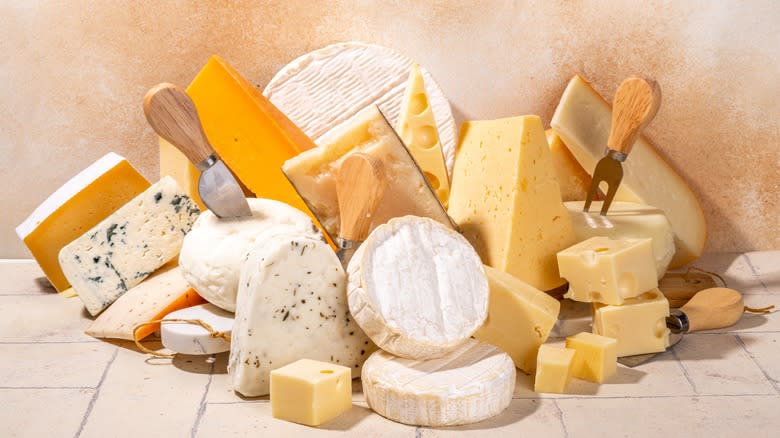 Variety of cheeses piled together