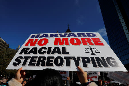 A supporter carrying a "Harvard No More Racial Stereotyping" sign attends the "Rally for the American Dream - Equal Education Rights for All," ahead of the start of the trial in a lawsuit accusing Harvard University of discriminating against Asian-American applicants, in Boston, October 14, 2018. REUTERS/Brian Snyder