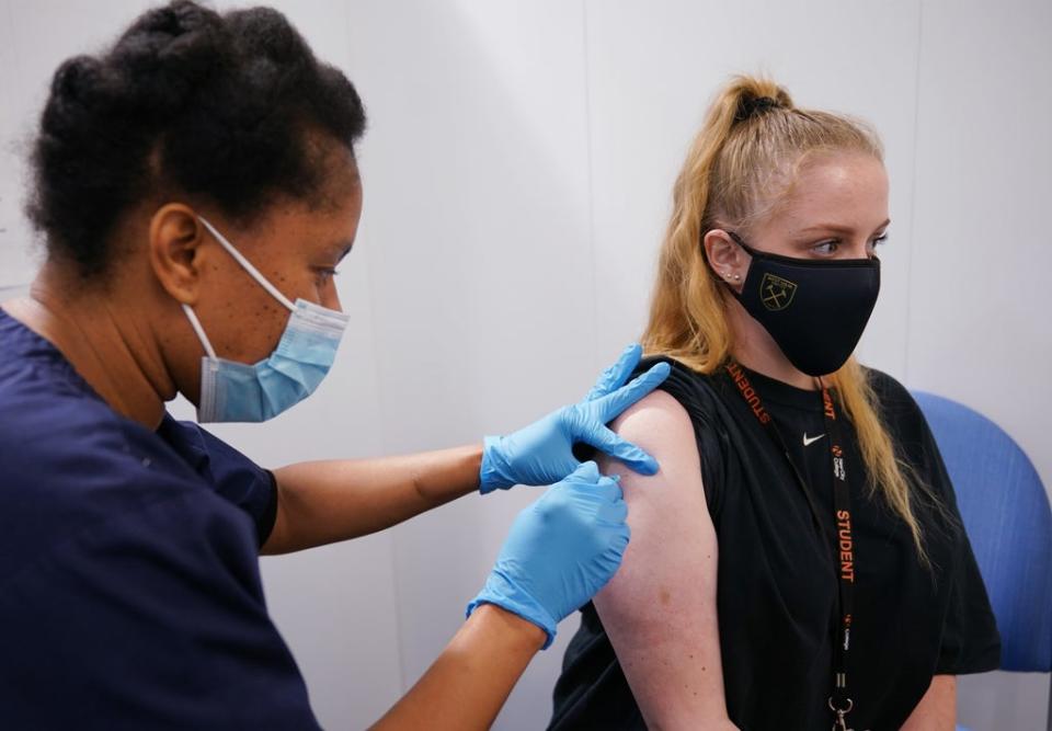 A woman receives her second dose of the Pfizer Covid-19 vaccination (PA) (PA Wire)