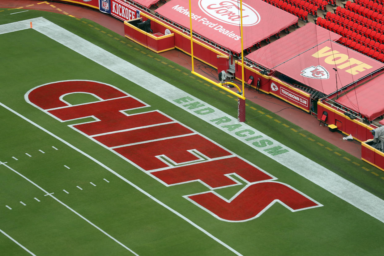 A detail of a saying "End Racism" is seen painted in the end zone.