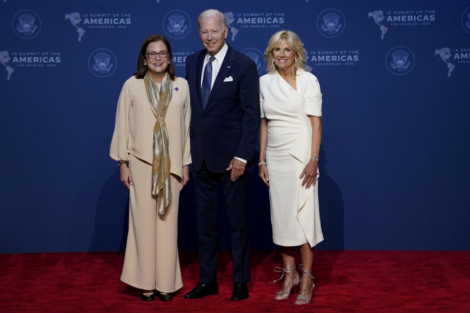 President Joe Biden, center, and first lady Jill Biden, greet Alexandra Hill, Minister of Foreign Affairs of the Republic of El Salvador, during the Summit of the Americas, Wednesday, June 8, 2022, in Los Angeles. (AP Photo/Evan Vucci)