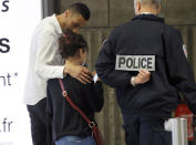 A relative of the victims of the EgyptAir Flight 804 is escorted at Charles de Gaulle Airport outside of Paris, Thursday, May 19, 2016. (AP/Michel Euler)