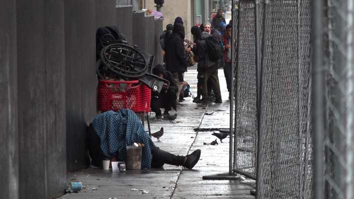 Drug users at a bus stop