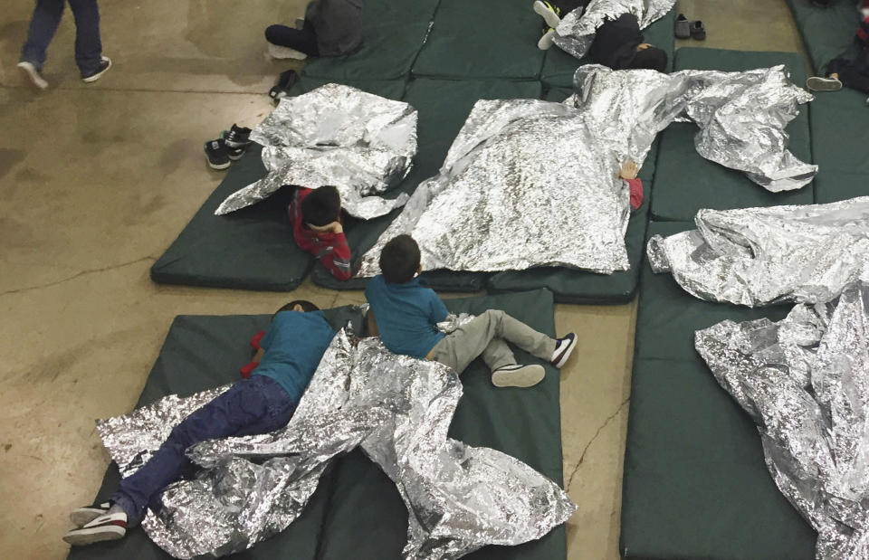 <p>People who’ve been taken into custody related to cases of illegal entry into the United States, rest in one of the cages at a facility in McAllen, Texas, Sunday, June 17, 2018. (Photo: U.S. Customs and Border Protection’s Rio Grande Valley Sector via AP) </p>