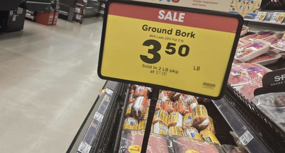 Sale sign for "Ground Bork" at $3.50 per pound, indicating a grocery store meat section