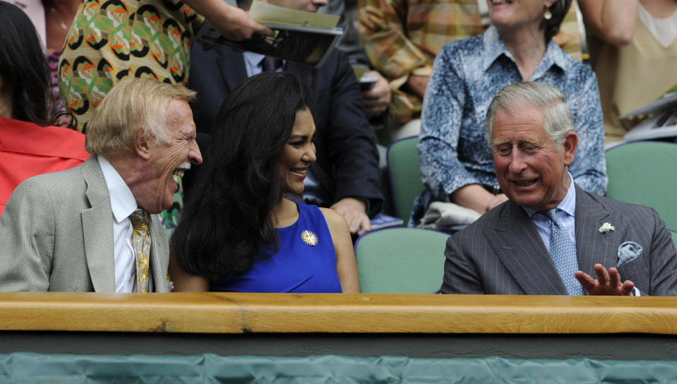 To see you nice! Prince Charles speaks to the late Sir Bruce Forsyth and his wife Wilnelia in the Royal Box during the 2012 Wimbledon Championships. (PA Images)