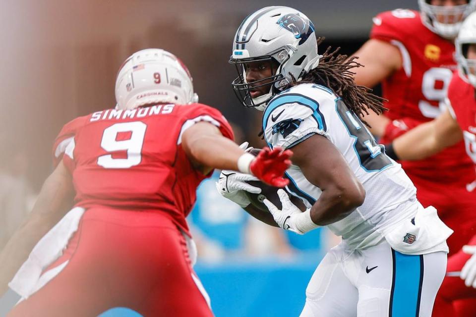 Carolina Panthers tight end Ian Thomas (80) runs the ball against Arizona Cardinals linebacker Isaiah Simmons (9) during a game at Bank of America Stadium in Charlotte, N.C., Sunday, Oct. 2, 2022.