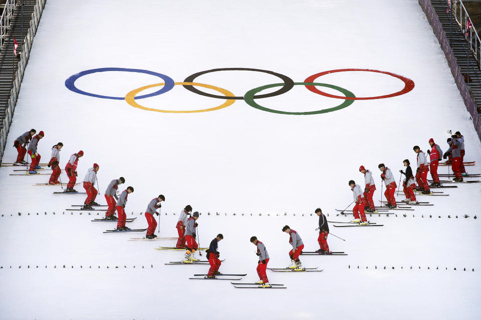 <p>Stadium crew members prepare the snow before a training session at the Alpensia Ski Jumping Center at the 2018 Winter Olympics in Pyeongchang, South Korea, Saturday, Feb. 17, 2018. (AP Photo/Jae C. Hong) </p>