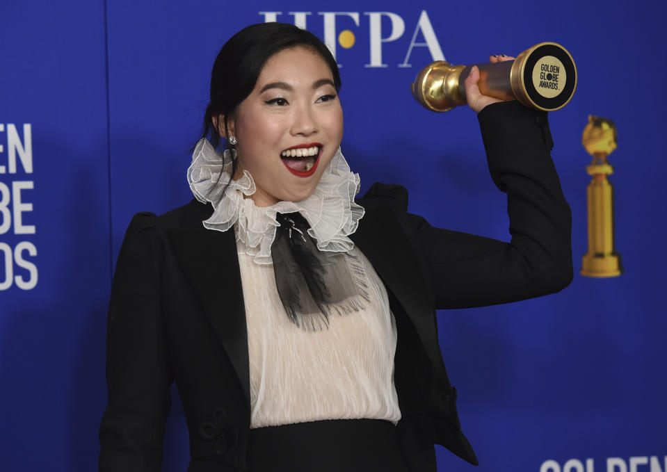 FILE - Awkwafina poses in the press room with the award for best performance by an actress in a motion picture, musical or comedy for "The Farewell" at the 77th annual Golden Globe Awards on Jan. 5, 2020, in Beverly Hills, Calif. Awkwafina turns 33 on June 2. (AP Photo/Chris Pizzello, File)