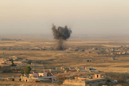 Smoke rises at Islamic State militants' positions in town of Naweran near Mosul. REUTERS/Zohra Bensemra