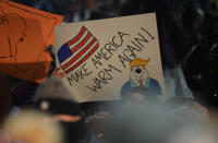 <p>One of Punxsutawney Phil’s followers holds a sign encouraging warmer weather at Gobbler’s Knob on the 132nd Groundhog Day in Punxsutawney, Pa., Feb. 2, 2018. (Photo: Alan Freed/Reuters) </p>