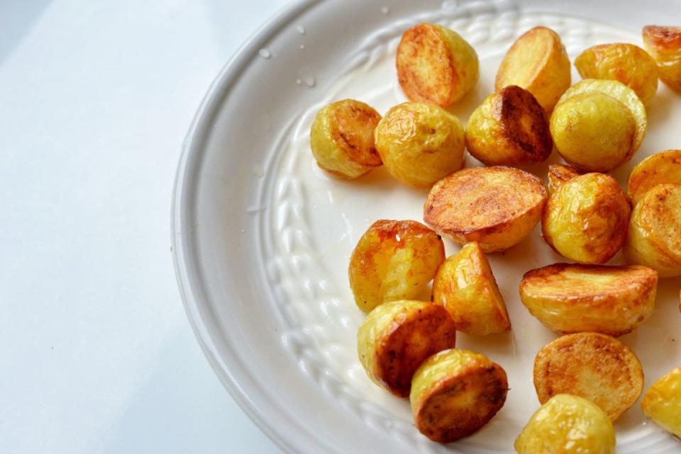 <p>When time is short, keep your side dishes simple.</p><p><strong>Recipe: <a href="https://www.goodhousekeeping.com/uk/food/recipes/a24726918/roast-baby-potatoes/" rel="nofollow noopener" target="_blank" data-ylk="slk:Roasted baby potatoes;elm:context_link;itc:0;sec:content-canvas" class="link ">Roasted baby potatoes</a></strong></p>