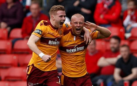 Motherwell's Curtis Main, right, celebrates with Christopher Cadden after scoring their first goal in the semi-final victory over Aberdeen - Credit: LEE SMITH/REUTERS