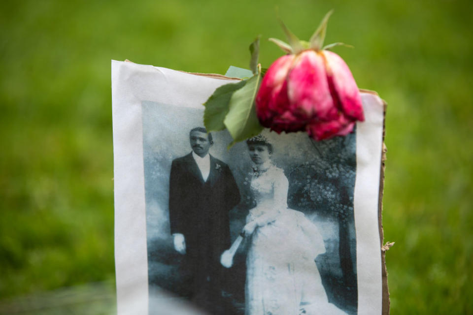 A photograph of Charles and Willa Bruce, is part of a memorial to Emmett Till, located in front of a commemorative plaque at Bruces Beach, a park located in Manhattan Beach. 