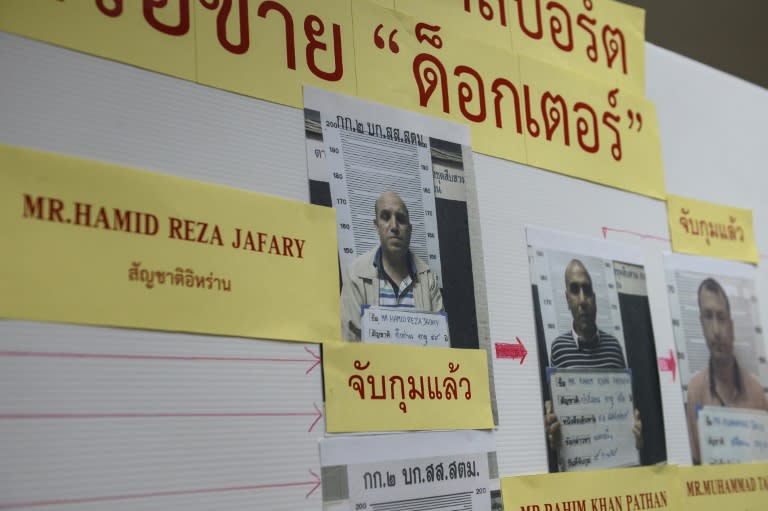 A mugshot of Iranian passport forger 'The Doctor' Hamid Reza Jafary (L) is displayed with his cohorts at the Immigration Detention Centre in Bangkok on July 22, 2016