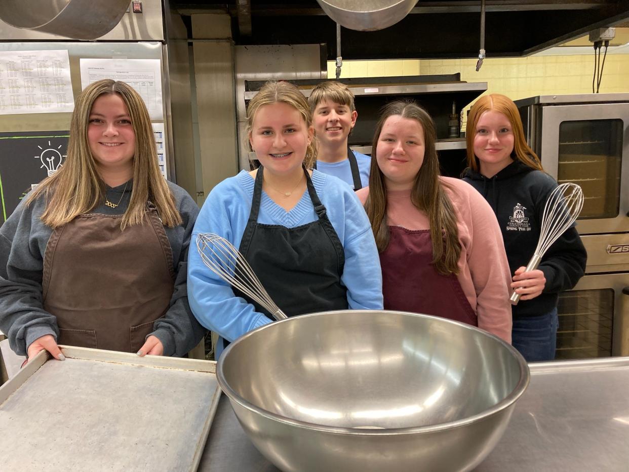 United High School students, front row from left, Sophia Johnston, Adelyn Johnson and Abigail Jones; and, back row from left, Seth Blake and Madelyn French will be part of the annual school cookie tray sale.