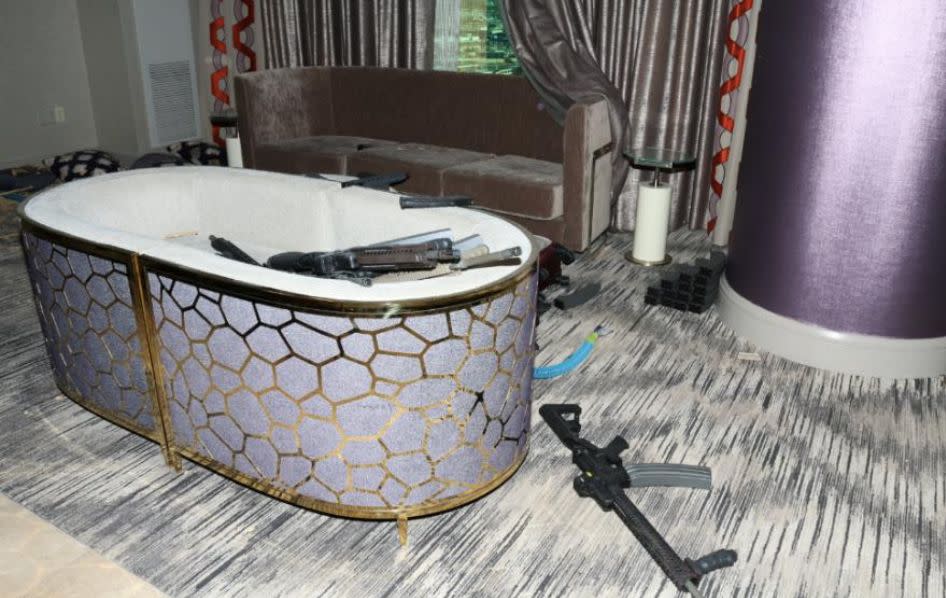 Two chairs pushed together hold firearms in Stephen Paddock's Mandalay Bay hotel room. (Photo: LVMPD)