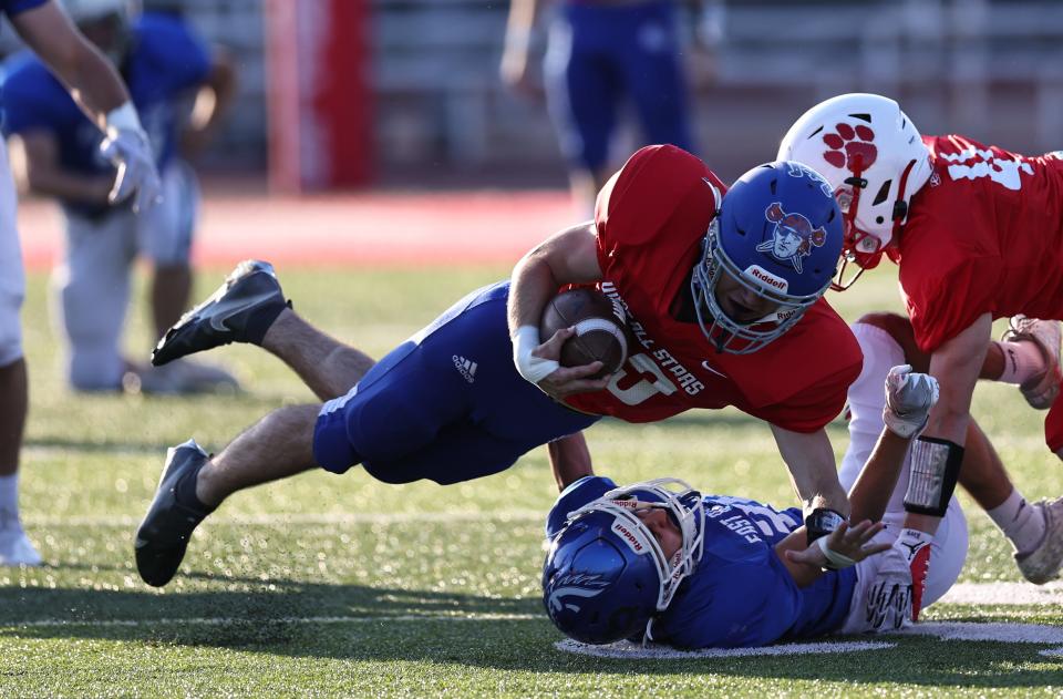 West running back Damond Hacker runs the ball during the East vs. West All-Star football game at Dixie Heights High School, Thursday, June 9, 2022.