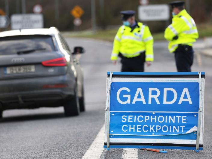 Garda Shiokana (Ireland Police) patrols a checkpoint near the Irish border in Ravensdale, Ireland, on Monday, February 8, 2021. Enforce new Covid-19 regulations.