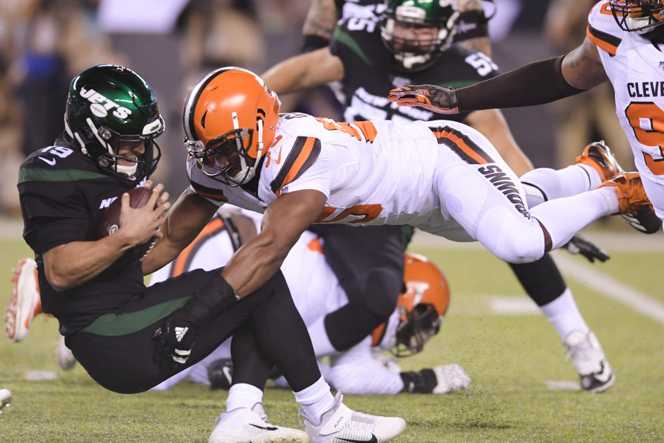 Cleveland Browns' Myles Garrett (95) sacks New York Jets' Trevor Siemian (19) during the first half of an NFL football game Monday, Sept. 16, 2019, in East Rutherford, N.J. (AP Photo/Bill Kostroun)