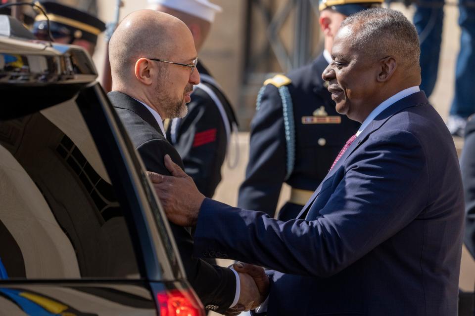 Ukrainian Prime Minister Denys Shmyhal, left, is greeted by Secretary of Defense Lloyd Austin upon his arrival at the Pentagon on April 12, 2023.
