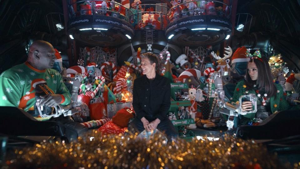 Drax, Kevin Bacon, and Mantis inside the Bowie decorated in Christmas decor in The Guardians of the Galaxy Holiday Special