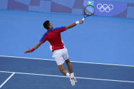 Novak Djokovic, of Serbia, returns to Alejandro Davidovich Fokina, of Spain, during the third round of the men's tennis competition at the 2020 Summer Olympics, Wednesday, July 28, 2021, in Tokyo, Japan. (AP Photo/Patrick Semansky)