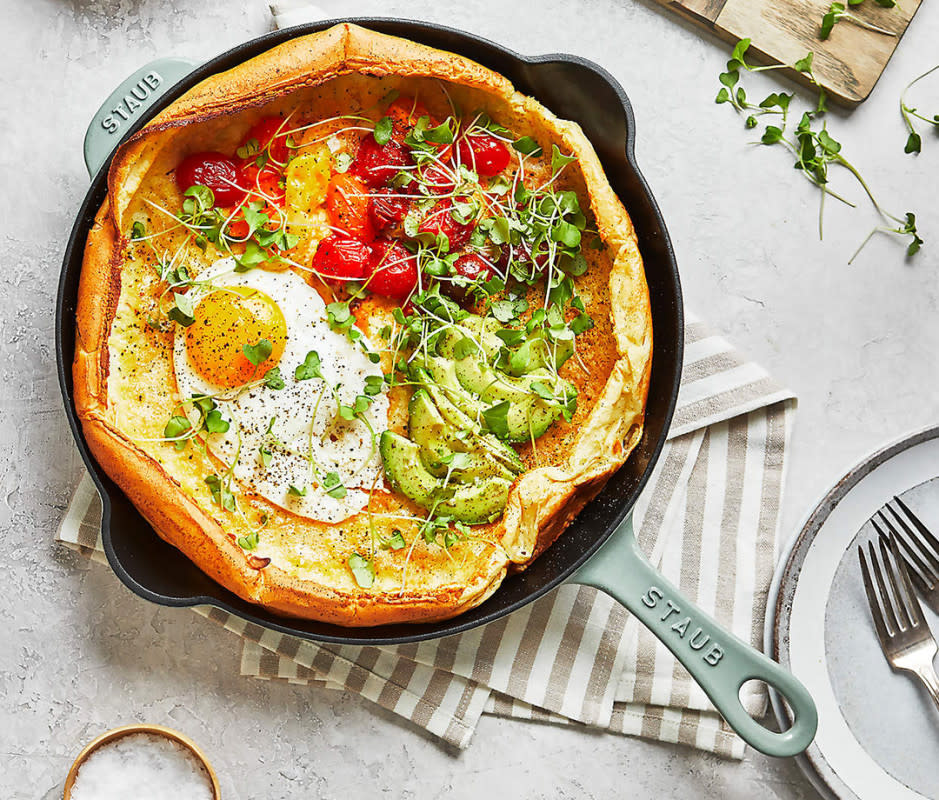 <p>Courtesy Image</p><p>Any culinary whiz will be thrilled to receive something from Staub. The brand's <a href="https://www.crateandbarrel.com/staub-11-eucalyptus-frying-pan/s178558" rel="nofollow noopener" target="_blank" data-ylk="slk:Enameled Cast Iron Pans;elm:context_link;itc:0;sec:content-canvas" class="link ">Enameled Cast Iron Pans</a> are venerated for their quality. Available in 10-, 11-, and 12-inch iterations, they're kitchen workhorses that ensure even heat distribution and retention. Your Mom can make skillet cookie with the grandkids, Dutch baby pancakes for Sunday brunch, and crispy-skin salmon on weeknights. Its smooth enamel finish also makes it a stylish addition to her kitchen that she’ll want to leave on the burner top to show off in perpetuity. </p>