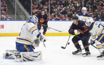 Buffalo Sabres goalie Ukko-Pekka Luukkonen (1) makes a save against Edmonton Oilers' Ryan McLeod (71) during second-period NHL hockey game action in Edmonton, Alberta, Thursday March 21, 2024. (Jason Franson/The Canadian Press via AP)