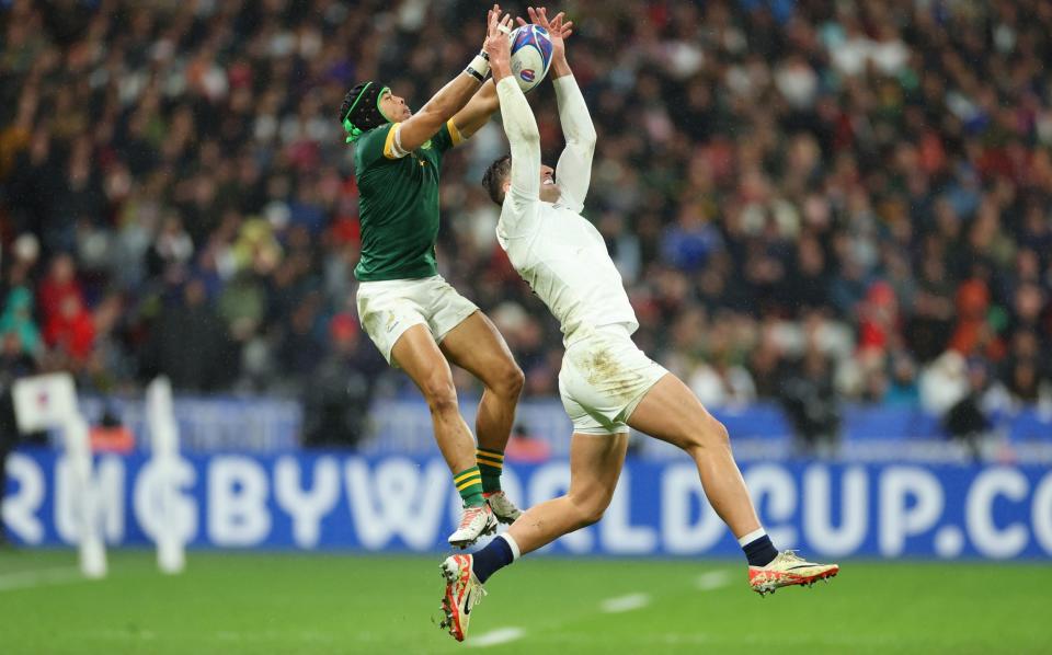 Jonny May (right) catches above his head to evade Kolbe