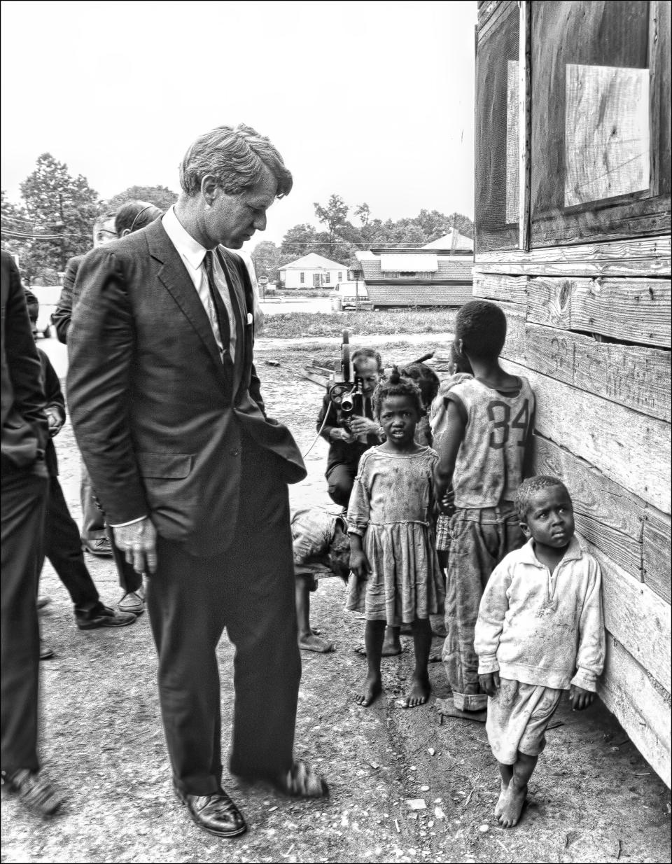 <p>Kennedy in Cleveland, Miss., visits children from the Dillard family on April 11, 1967. (Photo: Dan Guravich) </p>