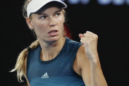 Tennis - Australian Open - Third Round - Melbourne Park, Melbourne, Australia, January 18, 2019. Denmark's Caroline Wozniacki reacts during the match against Russia's Maria Sharapova. REUTERS/Aly Song