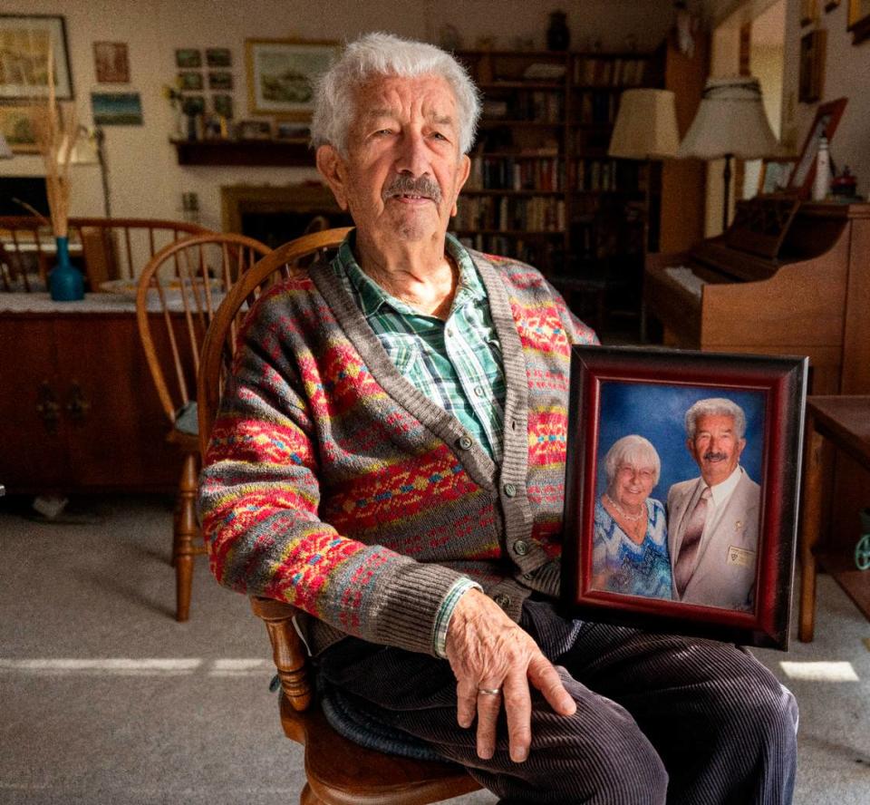 Bruno Zoanelli holds a portrait of he and wife Karin Zoanelli at his home on Tuesday, November 28, 2023 in Pinehurst, N.C. Karin Zoanelli was the lone known victim of the December 2022 blackout, after her oxygen concentrator failed, leading to her death.