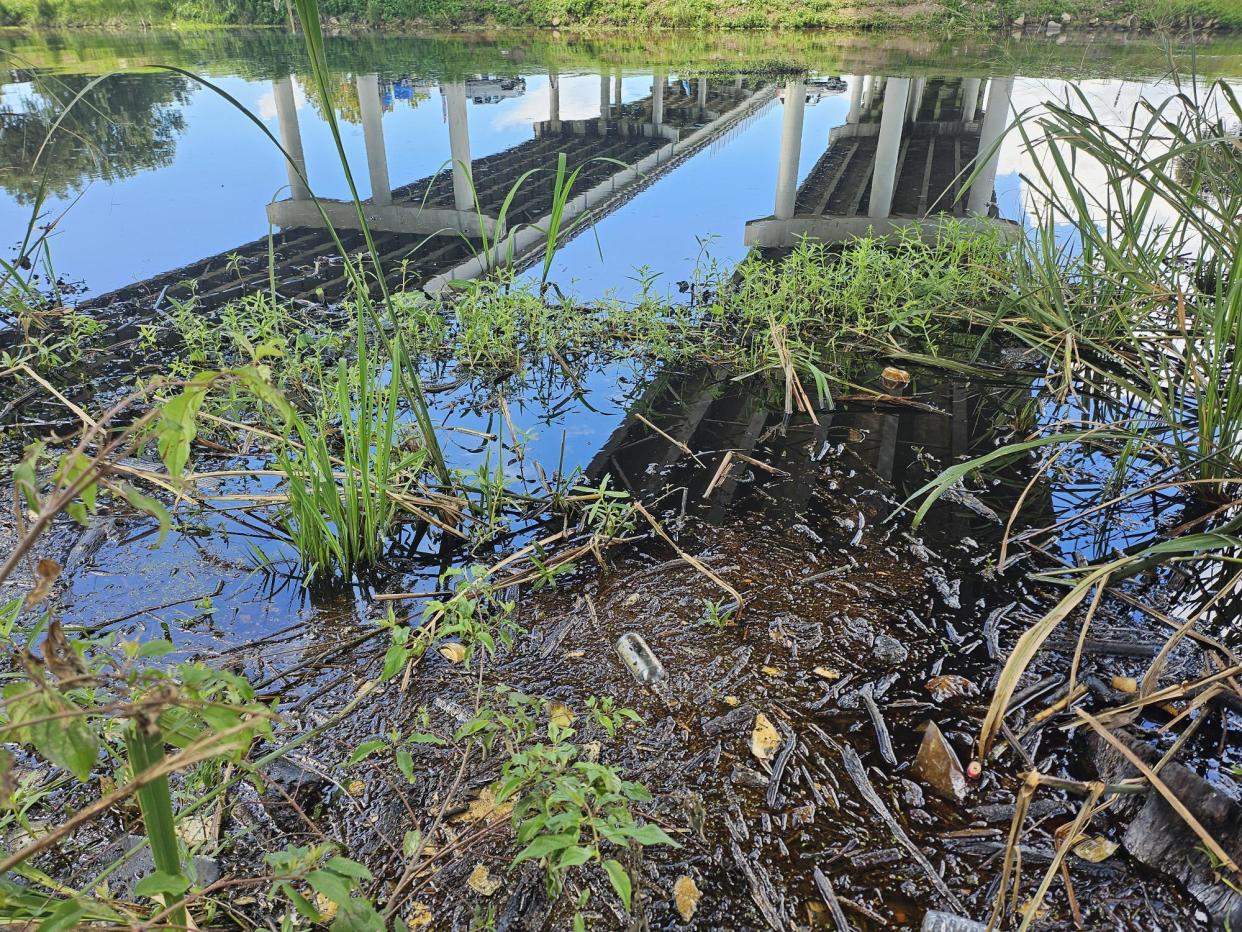 Crude oil invades Bayou Lafourche Saturday, July 27, from a leak at a Crescent Midland facility between 4065 and 4101 LA 308.