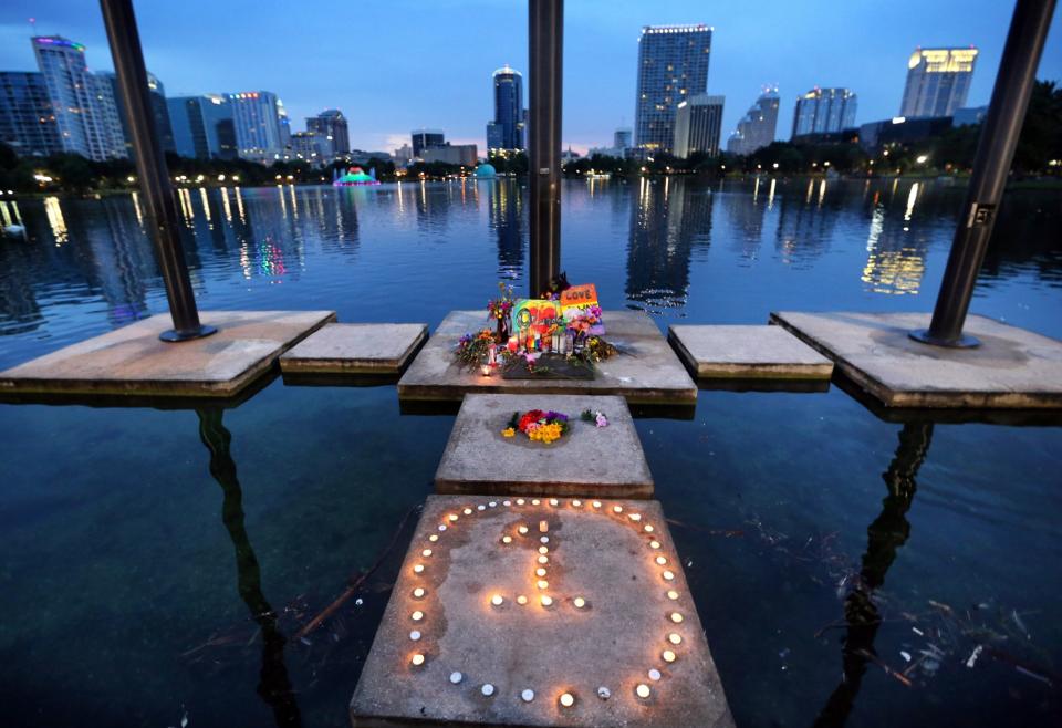 <p>The symbol for ‘One Orlando’ is spelled out at a makeshift memorial at Lake Eola in downtown Orlando, Fla., Saturday, June 18, 2016. (Joe Burbank(/Orlando Sentinel via AP) </p>