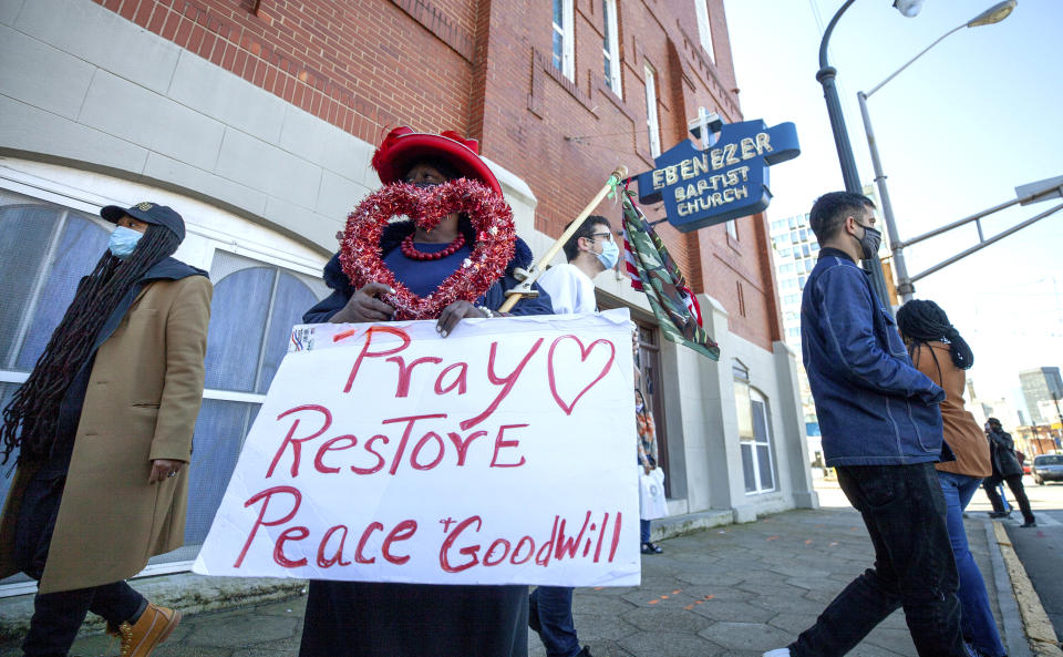 G.A. Breedlove stands outside of the historic Ebenezer First Baptist Church where Martin Luther King Jr. preached on Monday, Jan. 18, 2021, in honor of Martin Luther King Jr. Day, in Atlanta. (AP Photo/Branden Camp)