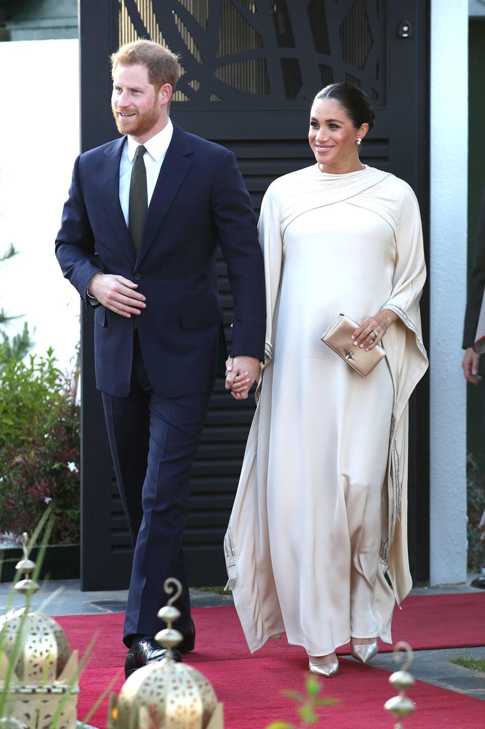 The royal mom-to-be looked regal in a bespoke dress by Dior featuring draped sleeves for a reception during the couple's tour of Morocco in February.