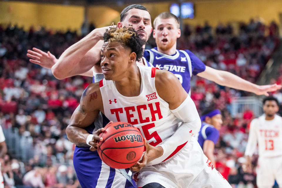 Adonis Arms of the Texas Tech Red Raiders handles the ball against Ismael Massoud of Kansas State during an NCAA college basketball game on Feb. 28. (John E. Moore III/Getty Images)