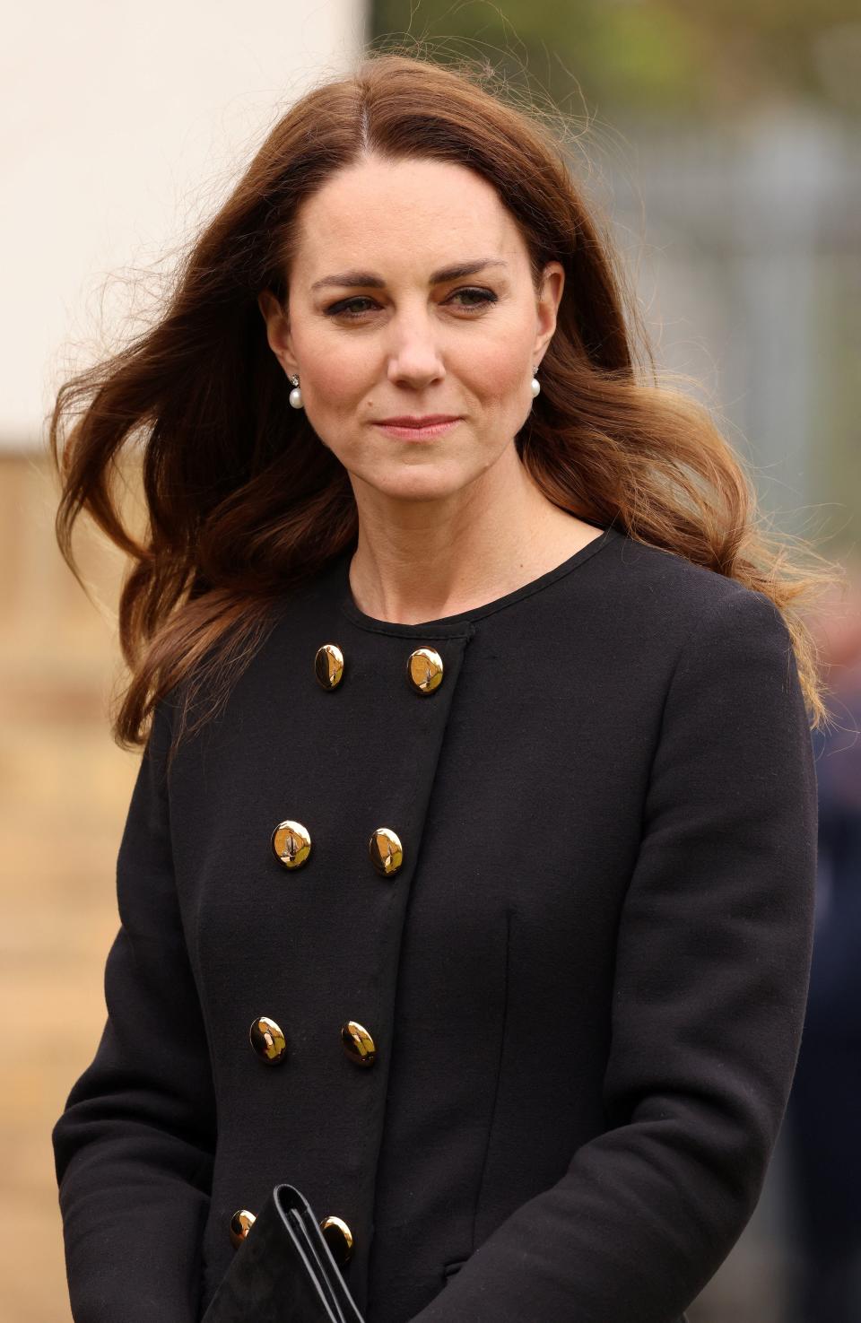 Britain's Catherine, Duchess of Cambridge, wearing black as a mark of respect following the death of Britain's Prince Philip, Duke of Edinburgh, meet air Cadets during their visit to 282 (East Ham) Squadron Air Training Corps in east London on April 21, 2021