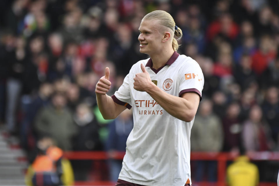 Manchester City's Erling Haaland celebrates scoring his side's 2nd goal during the English Premier League soccer match between Nottingham Forest and Manchester City at the City Ground stadium in Nottingham, England, Sunday, April 28, 2024. (AP Photo/Rui Vieira)