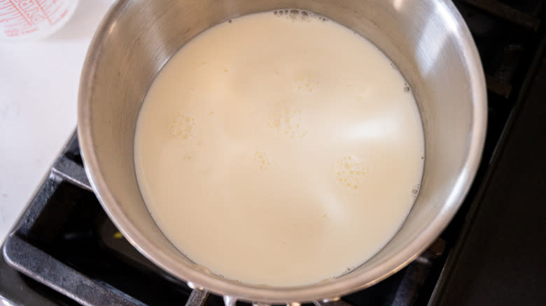 milk warming in saucepan