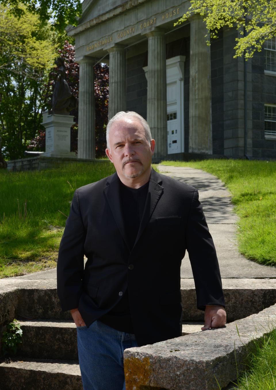 Author Casey Sherman stands outside of the Barnstable County Superior Courthouse. His latest book, "Helltown," is about Provincetown serial killer Tony Costa, whose trial took place at the courthouse.