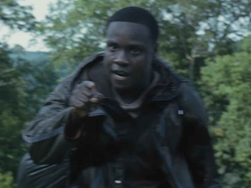 thresh pointing his finger angrily at katniss in hunger games catching fire