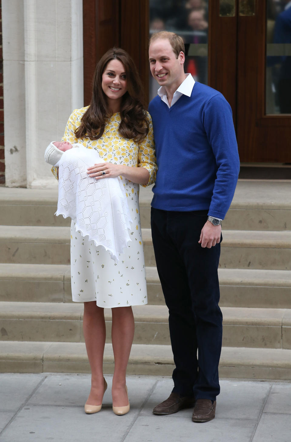 The Duke and Duchess of Cambridge debuted their second child, Princess Charlotte, to the world on May 2, 2015. Their daughter was delivered at 8:34am and weighed 8lbs 3 oz. For the big reveal, Kate chose a Jenny Packham dress in spring-ready yellow. [Photo: Getty]