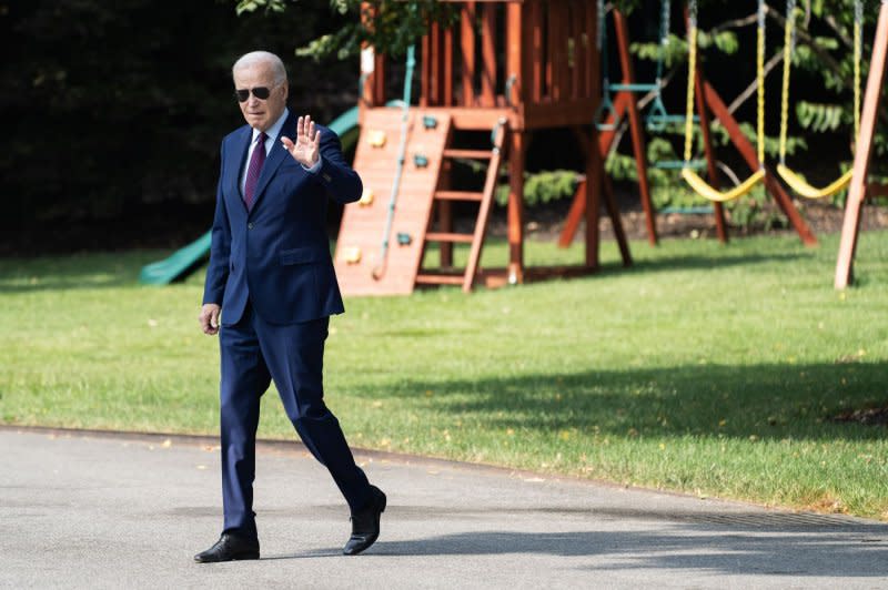 President Joe Biden walks on the South Lawn of the White House before boarding Maine One on Friday on his way to at Auburn Manufacturing Inc. in Auburn, Maine. Photo by Nathan Howard/UPI